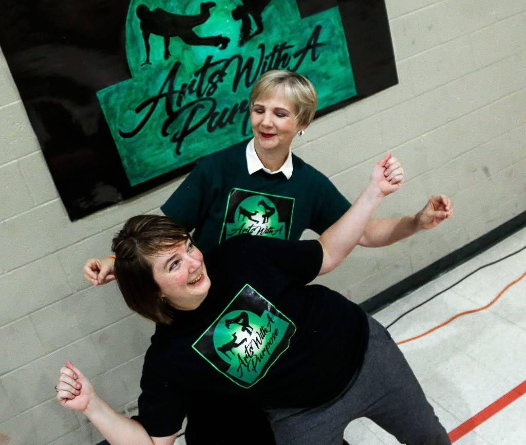 In the gym at Denney Juvenile Justice Center, dance teacher Emmy Fansler (left) and director Alison Herron of Arts With A Purpose prepare for detainees who have been learning hip-hop dance technique. (Dan Bates / The Herald)