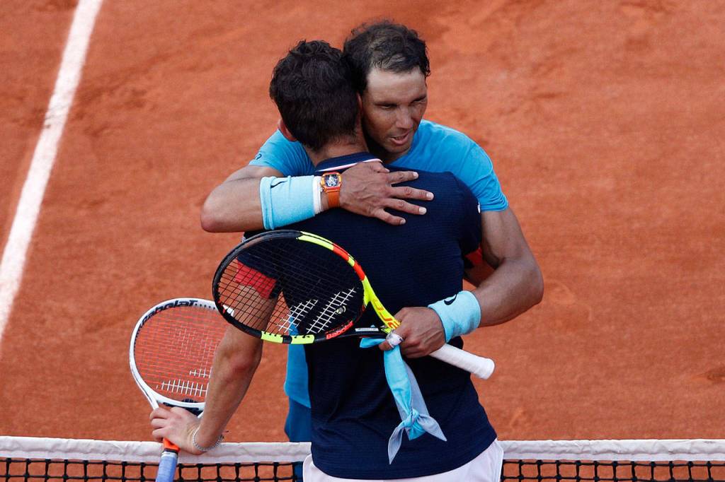 Spains Rafael Nadal, right, hugs Austrias Dominic Thiem after the mens final match of the French Open tennis tournament at the Roland Garros stadium, Sunday, June 10, 2018 in Paris. Nadal won 6-4, 6-3, 6-2. (AP Photo/Christophe Ena)