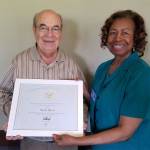 Lynnwood Councilwoman and RSVP Advisory Council member Shirley Sutton presents volunteer Ralph Quaas with a Presidents Call to Service Llifetime Service Award. (Contributed photo)