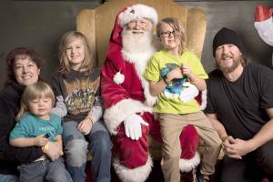 The Drake family poses with Santa in 2017. From left are Jenny, Dylan, Braeden, Zachary and Jerry Drake. (provided by family)