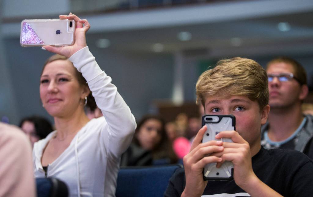 Family and friends watch the Sequoia High School graduation ceremony at the Everett Civic Auditorium on Thursday. (Andy Bronson / The Herald)