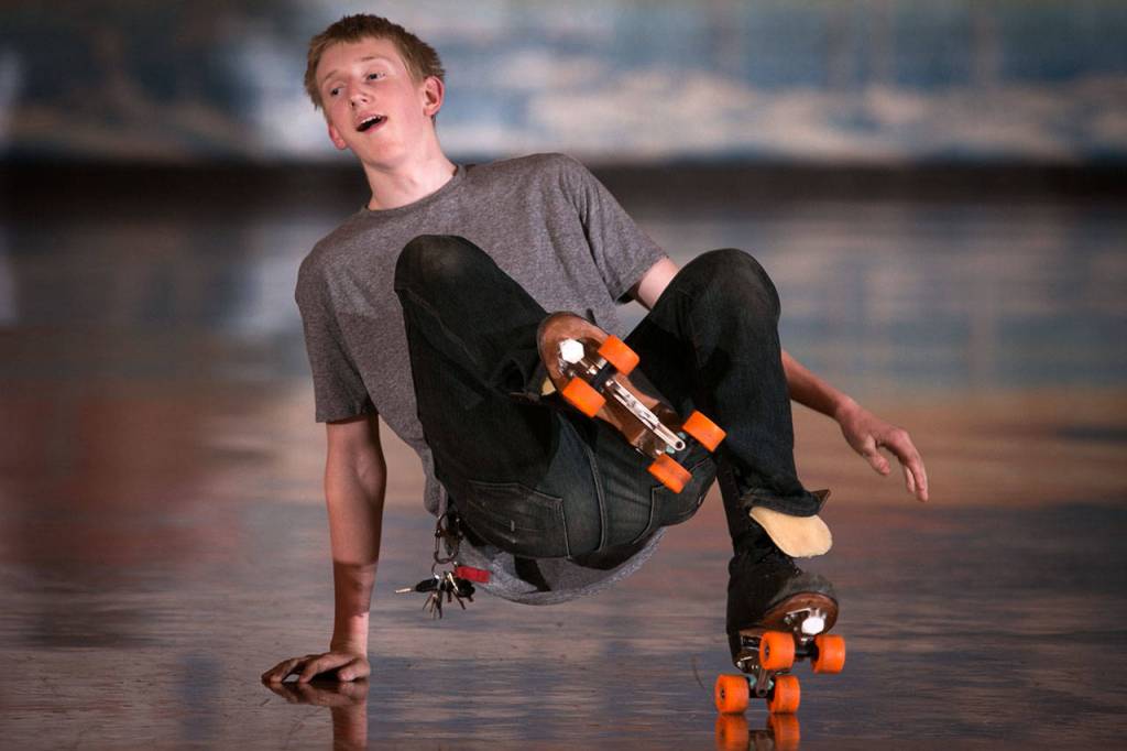 Andrew Beals performs on the rink Thursday night during Adult Open Skate at Lynnwood Bowl and Skate in Lynnwood on June 14, 2018. (Kevin Clark / The Herald)