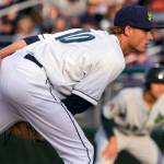 Aquasoxs Max Roberts looks for the signal with Hops Andy Yerzy leading off first base during the opening night at Everett Memorial Stadium Friday night. (Kevin Clark / The Herald)