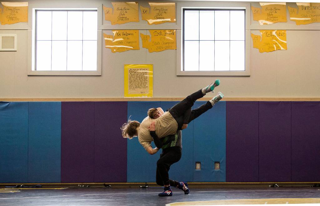 Hayden Long, of Granite Falls takes down Wyatt Springer as they work out at Lake Stevens High Schools wrestling room on Tuesday, June 5, 2018 in Lake Stevens, Wa. They will be representing Team Washington on the Cadet National Dual team that will compete for a national championship in Spokane in mid-June. (Andy Bronson / The Herald)