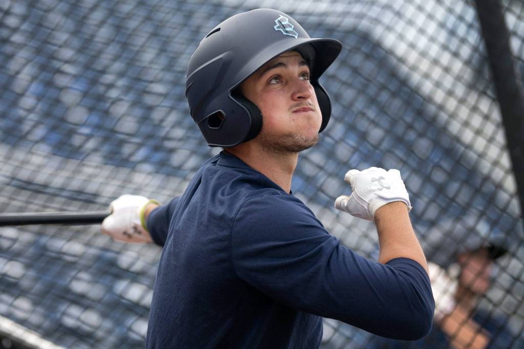 Ryne Ogren swings in the batting cage during practice at Everett Memorial Stadium in Everett on June 14. (Kevin Clark / The Herald)