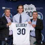 Seattle Mariners first-round draft pick Logan Gilbert is introduced at a news conference by director of amateur scouting Scott Hunter (left) and scout Rob Mummau on Saturday at Safeco Field. (AP Photo/John Froschauer)