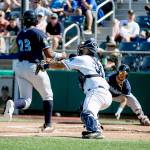 Hops Francis Martinez avoids a tag attempt by Aquasoxs Jake Anchia Sunday afternoon at Everett Memorial Stadium in Everett on June 17, 2018. (Kevin Clark / The Herald)