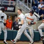 Oregon States Kyle Nobach (28)  a former Marysville Pilchuck High School and Everett Community College standout  celebrates with teammates following a three-run home run in the Beavers 14-5 win over Washington in an elimination game at the College World Series on Monday in Omaha, Nebraska. (AP Photo/Nati Harnik)