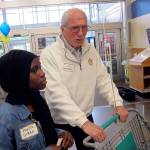With help from Rotary of Everett President Will McMahan, Cascade High School graduate Fanta Gibba sets out June 7 to find College Essentials items at the Mill Creek Fred Meyer store. Rotary provides ten students in the AVID program with $500 grants to buy college needs. (Contributed photo)
