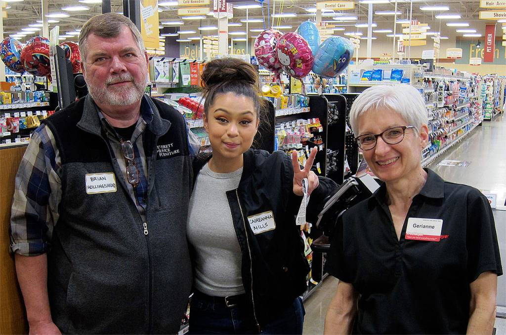 With help from Rotarian Brian Hollingshead and Fred Meyer sales associate Gerianne Johnson, Sequoia High School graduate Caireanna Mills (center) used a $500 Rotary grant to buy items she will need in college. (Contributed photo)