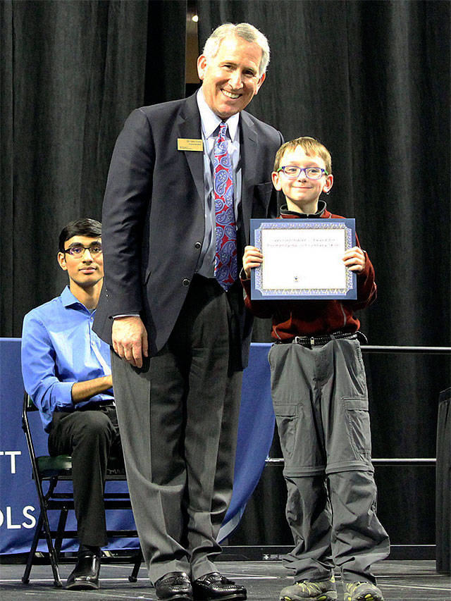 Everett schools Superintendent Gary Cohn presents Evergreen Middle School student Teddy Jackson with the Superintendents Award: Exemplifying 21st Century Skills. (Contributed photo)