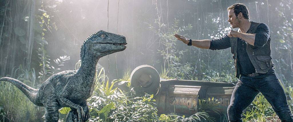 Lake Stevens High School graduate Chris Pratt squares off with a dinosaur in Jurassic World: Fallen Kingdom. (Universal Pictures)