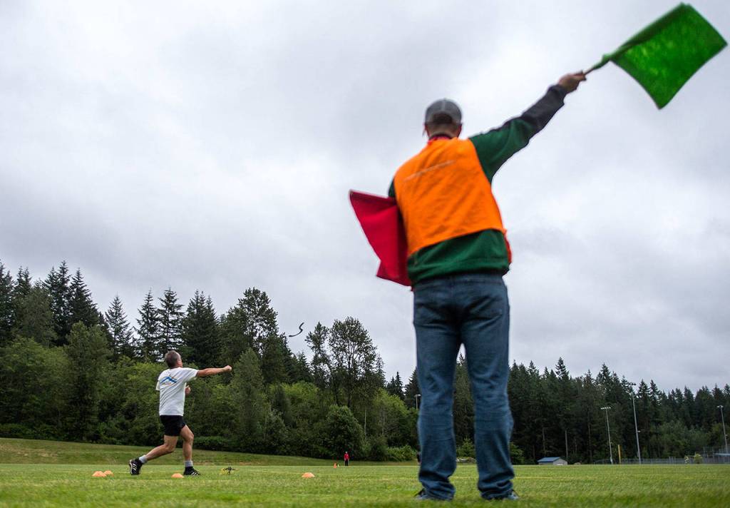 David Hirsch throws his boomerang during long distance practice at Lake Stevens Community Park on Friday, June 22, 2018. (Olivia Vanni / The Herald)