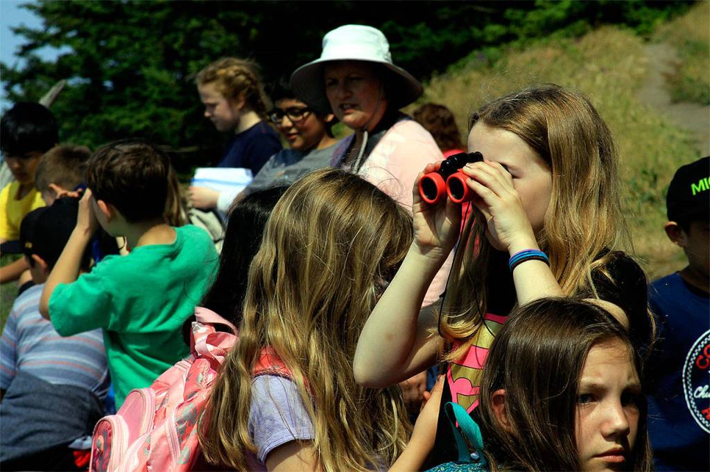 Fourth- and fifth-graders from Twin City Elementary School in Stanwood hike during a local geology field trip June 6 at Ebeys Landing on central Whidbey Island. (Contributed photo)