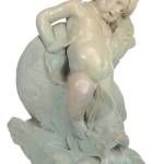 This 32-inch-high Rookwood faience fountain featuring a child and a dolphin spouts water from the dolphins mouth into a pond. The water recirculates thanks to a pump and when the water evaporates either a hose or rain refills it. It cost $2,300 at a Brunk auction in North Carolina a few years ago. (Cowles Syndicate Inc.)