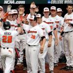 Oregon States Kyle Nobach  a former Marysville Pilchuck High School and Everett Community College standout  is greeted at the dugout after he scored against Mississippi State during the Beavers 12-2 win over the Bulldogs on Friday at the College World Series in Omaha, Nebraska. (AP Photo/Nati Harnik)