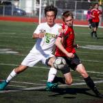 Snohomishs Conner Smith (right) gets pushed off the ball by Roosevelts Mattias Cochard during the 2017 3A State Championship at Sparks Stadium in Puyallup. (Ian Terry / Herald file)