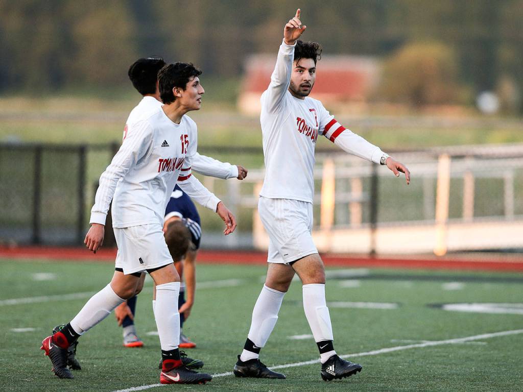 Marysville-Pilchucks Daniel Amador points to the stands after scoring a goal as Marysville Pilchuck beat Arlington 3-2 in a boys soccer match and clinched the Wesco 3A title on Tuesday, May 1, 2018 in Marysville. (Andy Bronson / The Herald)