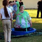 Brownie Troop 43244 leader Tina Fish makes good on a promise and gets covered in green slime at a June 21 celebration of the troops fundraising efforts for the Everett Fire Department. (Contributed photo)