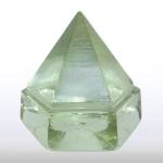 This glass prism with a slightly green tint is 4½ inches high and very heavy. It was used like a window on vintage sailing ships to get light below the main deck. Just an ornament today, it is worth about $50 in an online sale. (Cowles Syndicate Inc.)