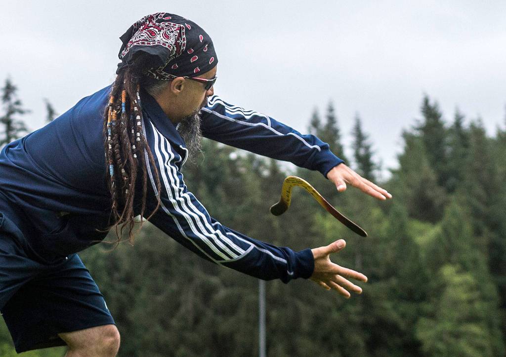 Kenny Barr catches a boomerang during his warmup at Lake Stevens Community Park on June 22. (Olivia Vanni / The Herald)