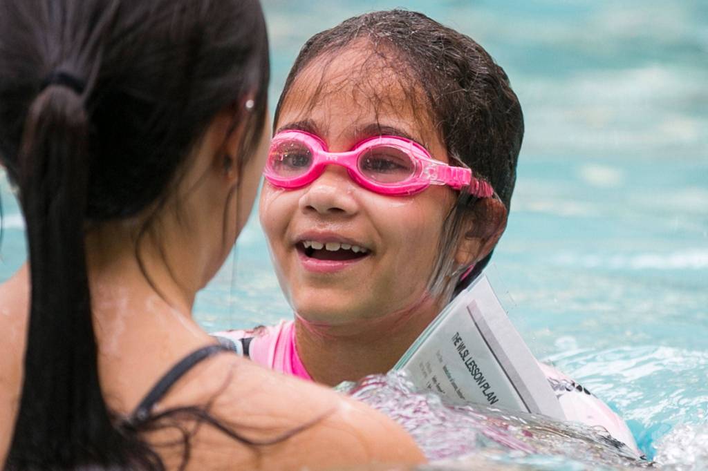 Tamia Reese reacts during swim safety lessons at Lynnwood Recreation Center on June 21. (Kevin Clark / The Herald)