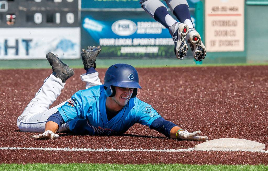 The Aquasoxs Ryne Ogren reaches for third base as the team took on Tri-City at Everett Memorial Stadium on June 24 in Everett. (Andy Bronson / The Herald)
