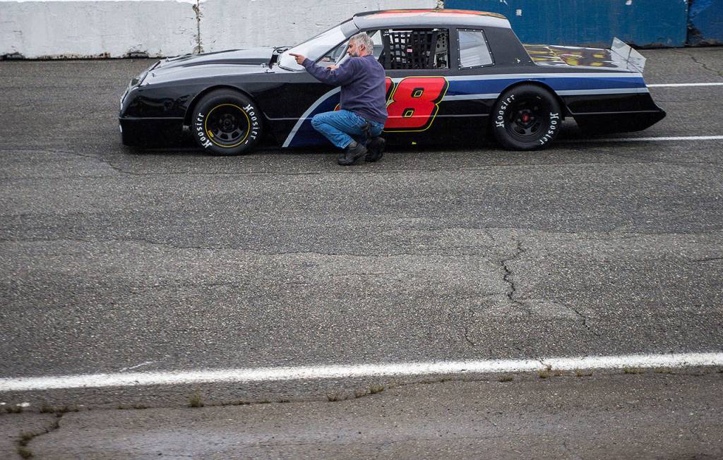 Bruce Pendergress talks with a driver before the start of their race at Evergreen Speedway on June 30, 2018, in Monroe. (Olivia Vanni / The Herald)