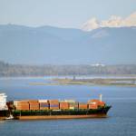 With Mount Baker and Jetty Island in the distance, a container ship approaches the Port of Everett. (Port of Everett)
