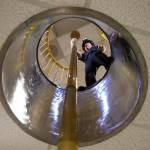 Firefighter Travis Smith gets ready to slide down the fire pole at Everett Fire Department Station 1. The pole is the only one remaining at an Everett firehouse. (Andy Bronson / The Herald)