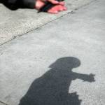 Mark Pitts attempts to stop people for signatures last week in Everett. (Olivia Vanni / The Herald)