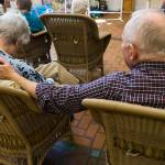 Jim Mallonee and Shirley Mallonee watch a dog perform a trick at Brookdale Silver Lake. (Olivia Vanni / The Herald)