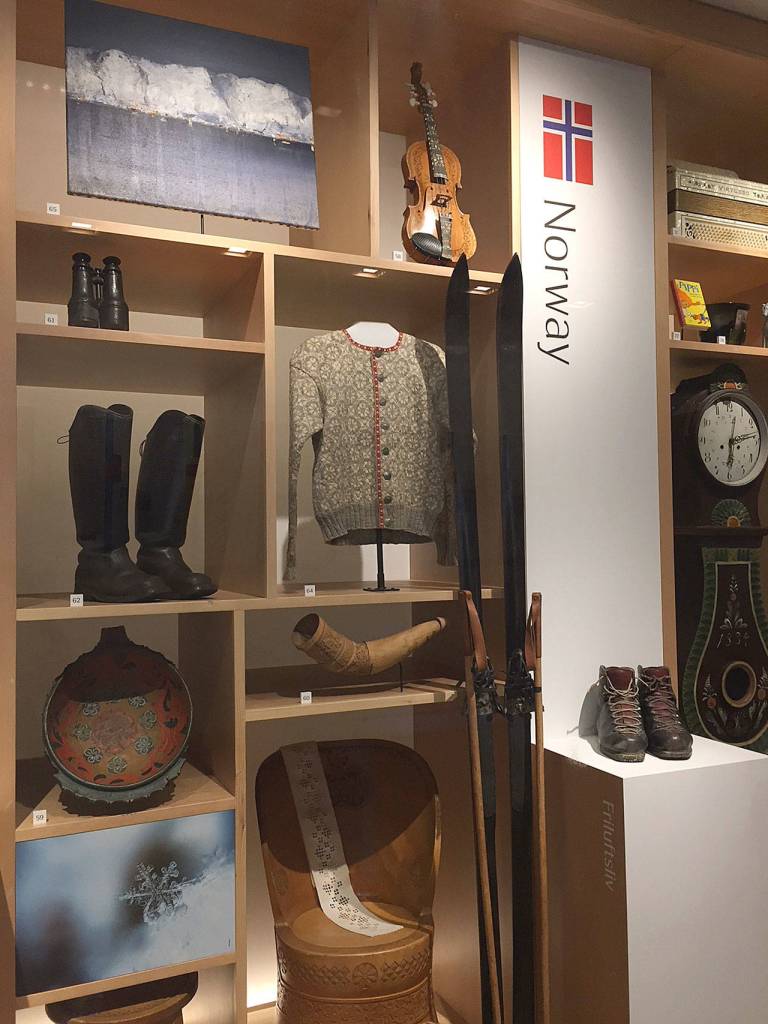 Authentic Norwegian items on display at the Nordic Museum, including a kubbestool, or log chair, hardanger fiddle and fishermans boots. Each of the Scandinavian countries have exhibits showing authentic items from the country. (Aaron Swaney)
