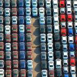 Cars are parked waiting to be exported near Tokyo. (Kyodo News via AP)
