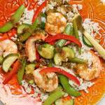 Steamed shrimp and summer vegetables topped with a ginger-soy drizzle. (Photo by Deb Lindsey for The Washington Post)