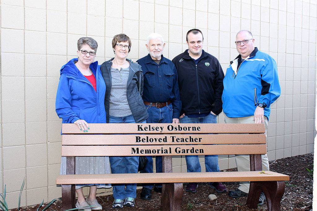 Family of Kelsey Osborne visit a garden planned in her memory by staff at Sunnycrest Elementary School, where she taught for two years. Pictured from left are her Aunt Rhonda Osborne-Gage, mother Diana Osborne, grandfather Al Osborne, fiance Kevin Lynch, and father Mike Osborne. (Family photo)
