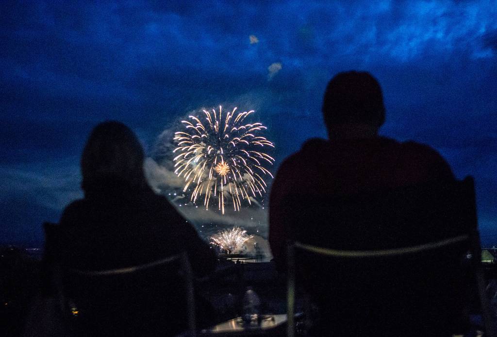 People watch the Thunder on the Bay Fireworks display from Legion Memorial Park on Wednesday in Everett. (Olivia Vanni / The Herald)