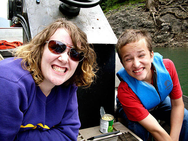 Miriam Robinson, left, on a fishing trip with her family friends, the Hennekes. She insisted on naming all of the fish she caught, Lacey Henneke said. (Family photo)
