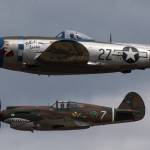 A P-47 Thunderbolt (top) passes a P-40 Tomahawk during maneuvers at the 50th annual Arlington Fly-In at the Arlington Airport on Saturday. (Andy Bronson / The Herald)