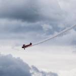 Smoke trails as pilot Vicky Benzing performs aerial maneuvers at the 50th annual Arlington Fly-In at the Arlington Airport on Saturday. (Andy Bronson / The Herald)