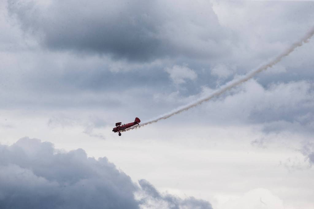 Smoke trails as pilot Vicky Benzing performs aerial maneuvers at the 50th annual Arlington Fly-In at the Arlington Airport on Saturday. (Andy Bronson / The Herald)