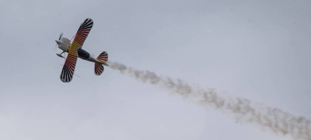 Steven Bennett side slips his Christen Eagle biplane at the 50th annual Arlington Fly-In at the Arlington Airport on Saturday. (Andy Bronson / The Herald)