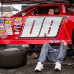 Traci Craig sits in her teams race car as the car gets prepped for the 200-lap Super Late Model race at the Summer Showdown at the Evergreen Speedway on June 30 in Monroe. (Olivia Vanni / The Herald)