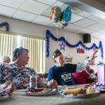 Edgar Shepherd, 100, talks to friends and family at the table during his 100th birthday celebration at the Lynnwood Elks Lodge on Wednesday, July 4, 2018 in Lynnwood, Wa. (Olivia Vanni / The Herald)