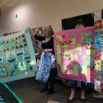 At their May meeting, members of the Mukilteo Lighthouse Quilters gave away over 125 quilts to Helping Hands and to Homage Senior Services. (Contributed photo)