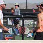 Tonja Major (right) and her mixed doubles partner discuss strategy during a pickleball match. (Selkirk Sport)