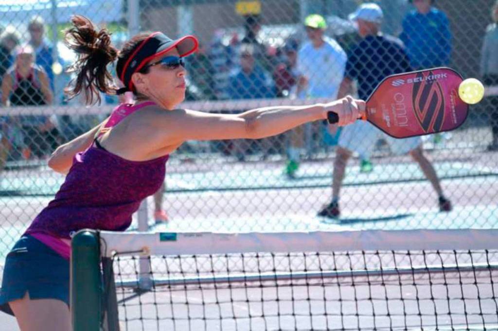 Tonja Major hits a back-handed shot during a pickleball match. (Selkirk Sport)