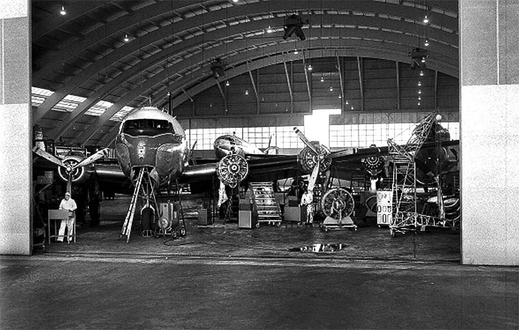 In this 1957 photo, an aircraft was being worked on inside the Alaska Airlines repair and maintenance hangar at Paine Field. Built in 1948, the hangar now houses the Flying Heritage & Combat Armor Museum. (Jim Leo / Everett Herald)