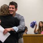 Eric Brossard receives a hug during Drug Court graduation as family and friends cheer in support at the Snohomish County Superior Court on Friday, July 13, 2018 in Everett, Wa. (Olivia Vanni / The Herald)