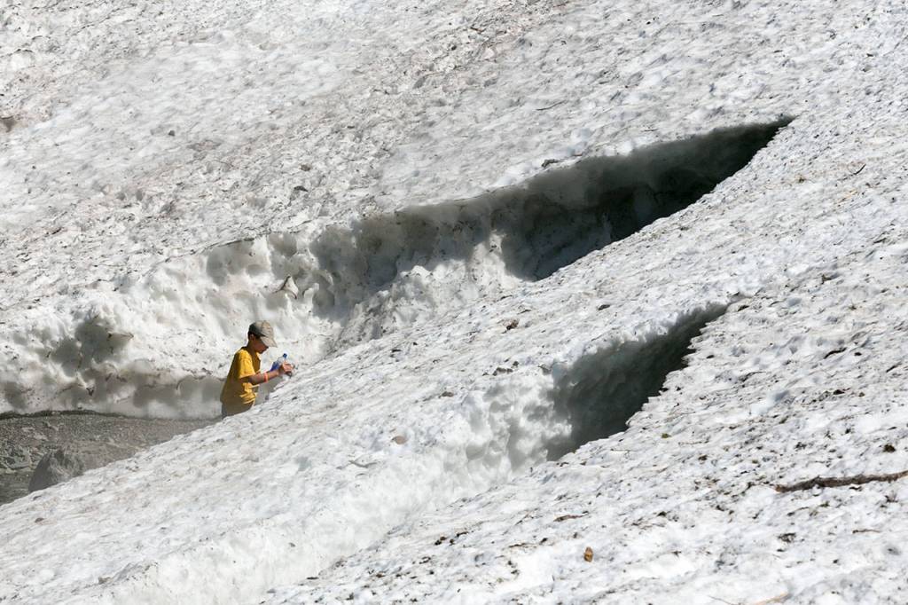 Snow and ice are collapsing at the Big Four Ice Caves and people are again being urged to stay away. (Kevin Clark / The Herald)